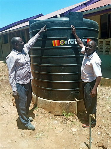 Inspecting the new rainwater tank at Kubar school in western Kenya.