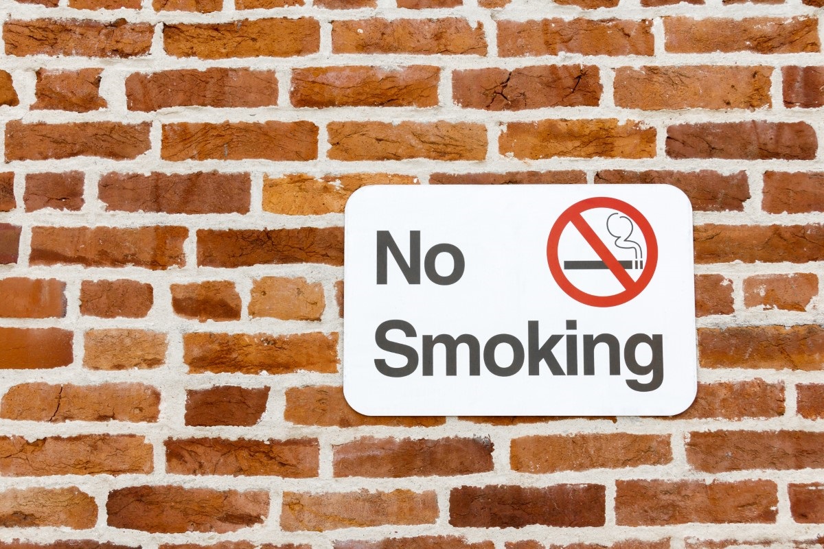 No smoking sign on brick wall