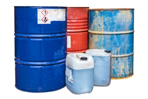 Barrels and plastic containers full of chemicals.