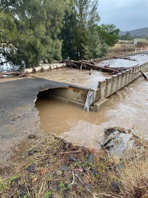 Flood damage to causeway on road