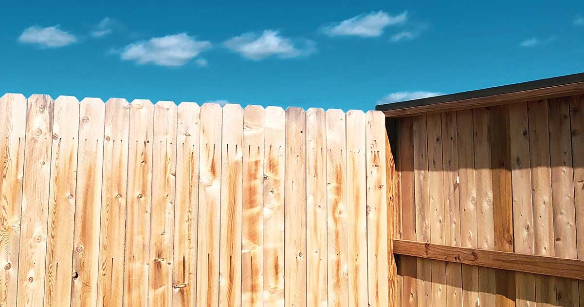 Timber fence and blue sky